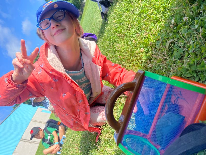 Camper enjoying programming outdoors.